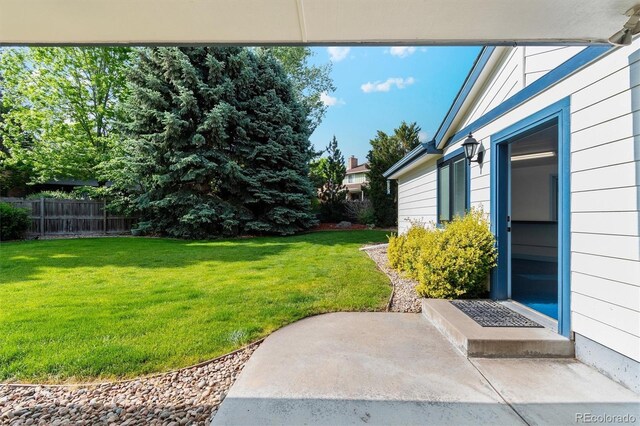 1998 S Harlan Ct, Lakewood, CO 80227 - view of yard with a patio