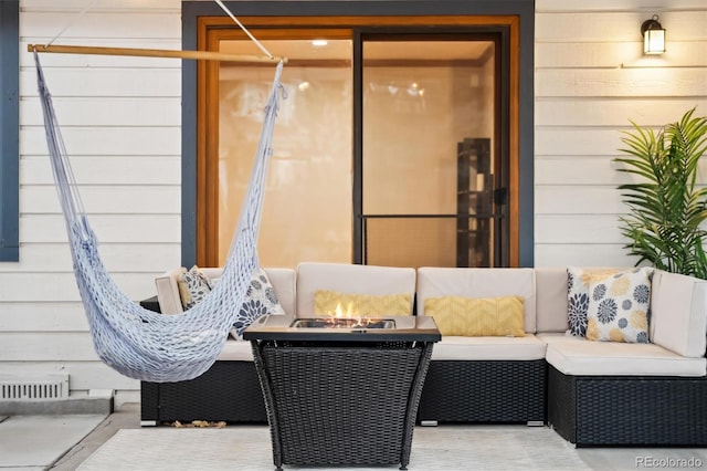 1998 S Harlan Ct, Lakewood, CO 80227 - view of patio / terrace featuring an outdoor living space with a fire pit