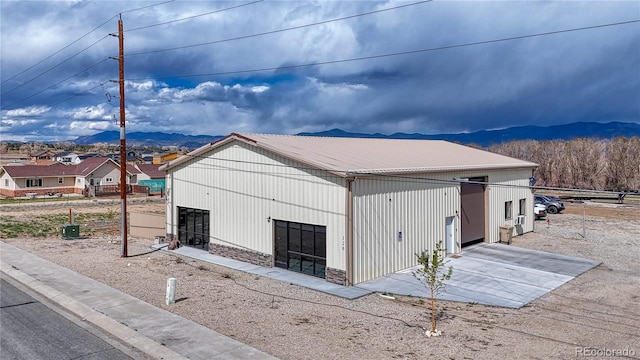 view of home's exterior featuring a mountain view and a garage