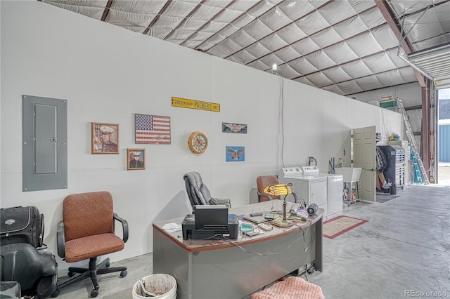 office space with concrete flooring and washing machine and clothes dryer