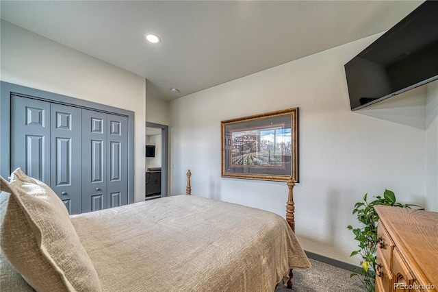 bedroom featuring a closet and carpet flooring