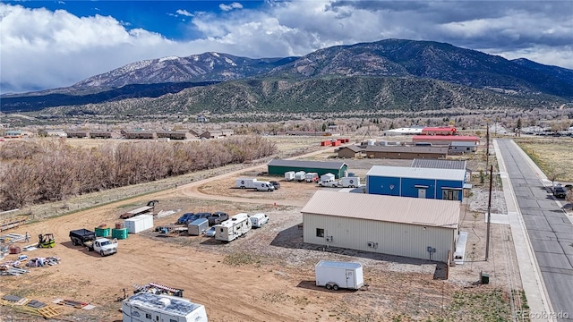 birds eye view of property with a mountain view