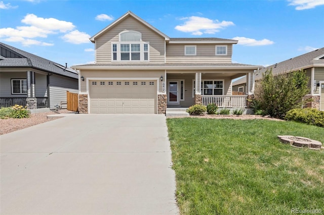 10414 Declaration Dr, Colorado Springs, CO 80925 - view of front of home featuring covered porch, a garage, driveway, a front lawn, and stone siding