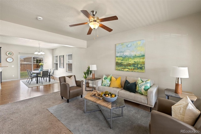 10414 Declaration Dr, Colorado Springs, CO 80925 - carpeted living area featuring ceiling fan and a chandelier