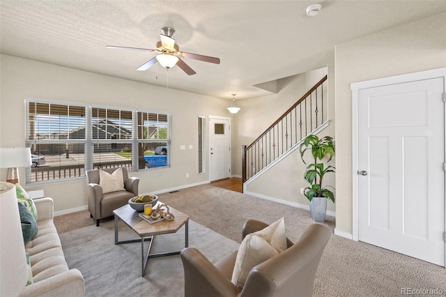 10414 Declaration Dr, Colorado Springs, CO 80925 - carpeted living room with a ceiling fan and stairs
