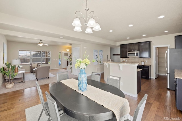 10414 Declaration Dr, Colorado Springs, CO 80925 - dining area featuring recessed lighting, dark wood-type flooring, a chandelier, and ceiling fan