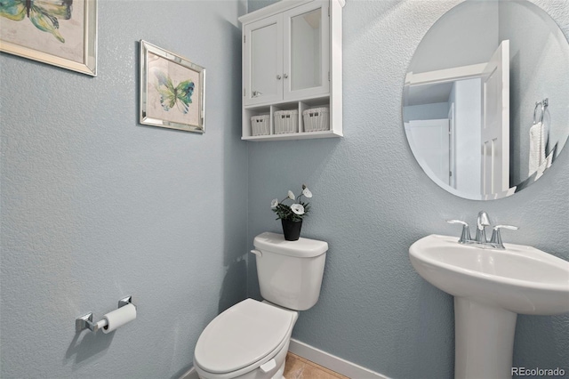 10414 Declaration Dr, Colorado Springs, CO 80925 - bathroom featuring toilet and a sink