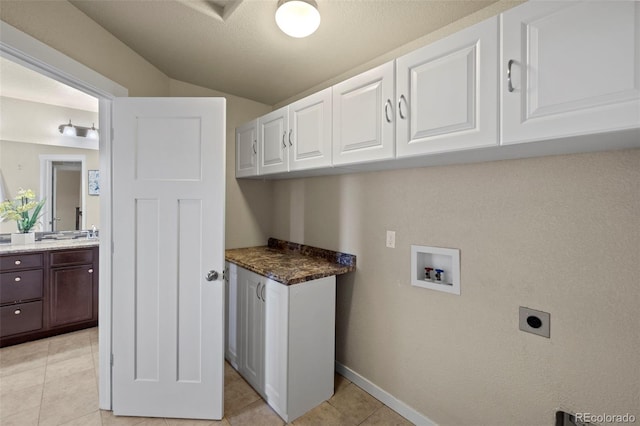 10414 Declaration Dr, Colorado Springs, CO 80925 - washroom with cabinet space, hookup for a washing machine, hookup for an electric dryer, and light tile patterned floors