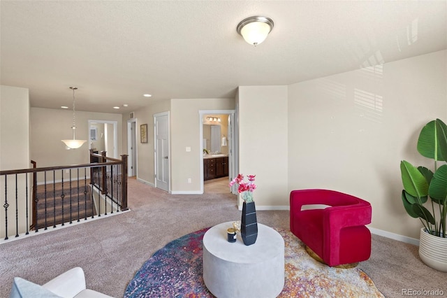 10414 Declaration Dr, Colorado Springs, CO 80925 - living area featuring an upstairs landing, carpet flooring, and recessed lighting