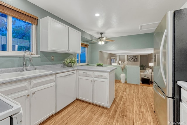 15918 E Flora Pl, Aurora, CO 80013 - kitchen with white appliances, light wood-style flooring, a sink, ceiling fan, and white cabinetry