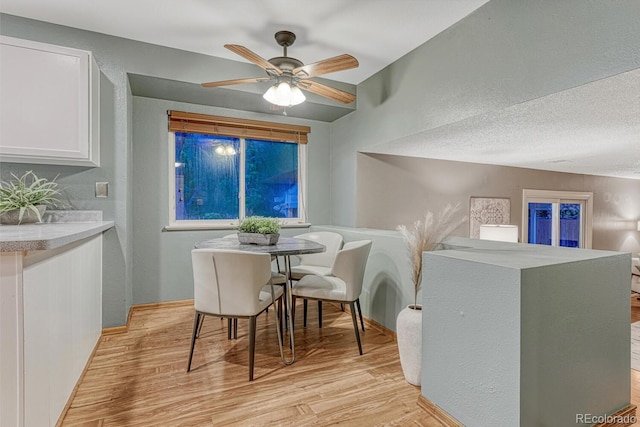 15918 E Flora Pl, Aurora, CO 80013 - dining space with light wood finished floors, a textured wall, and ceiling fan