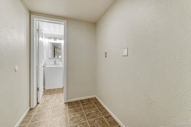 15918 E Flora Pl, Aurora, CO 80013 - hall with baseboards and a textured wall