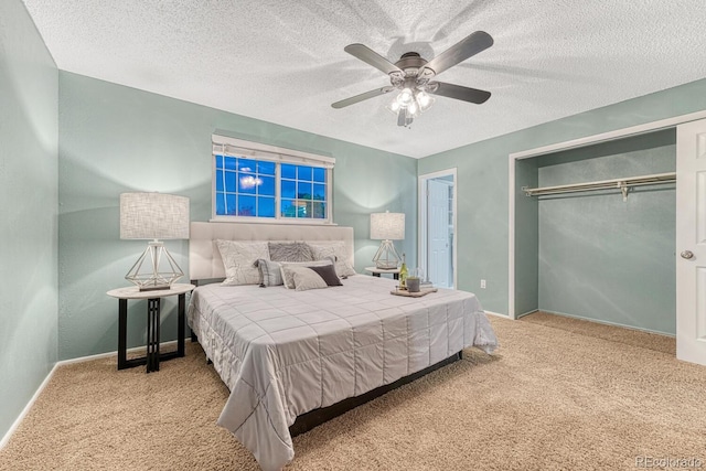 15918 E Flora Pl, Aurora, CO 80013 - bedroom featuring carpet, a closet, a textured ceiling, ceiling fan, and baseboards