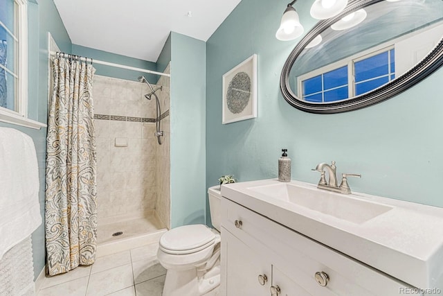 15918 E Flora Pl, Aurora, CO 80013 - full bath featuring vanity, toilet, tile patterned floors, and a tile shower