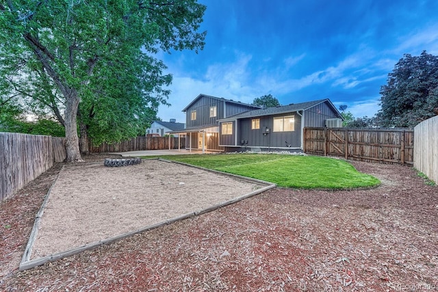 15918 E Flora Pl, Aurora, CO 80013 - back of property featuring board and batten siding and a patio area