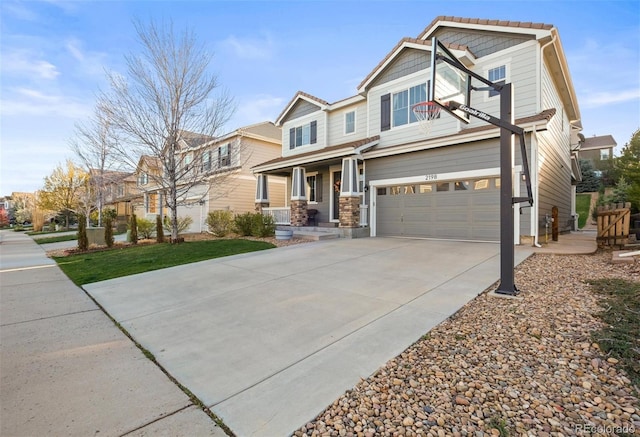 craftsman inspired home featuring a garage, driveway, and a porch