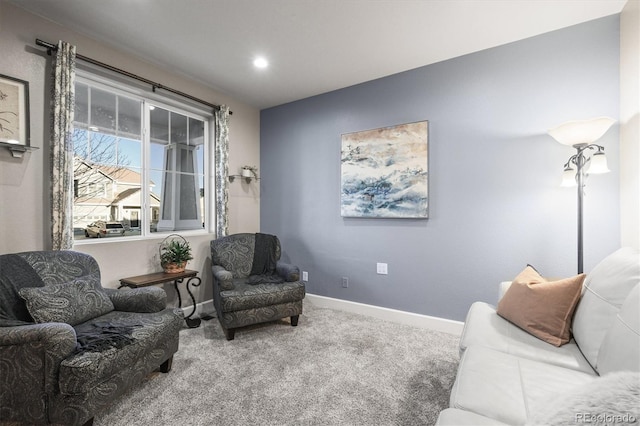sitting room with carpet floors and baseboards