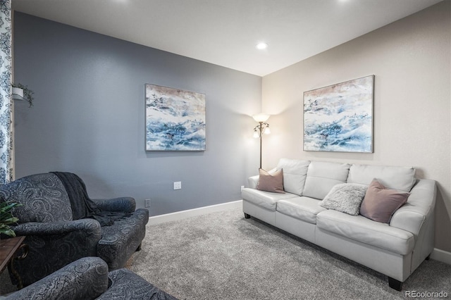carpeted living area with baseboards and recessed lighting