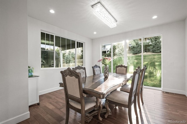 dining area with baseboards, dark wood-style floors, and recessed lighting