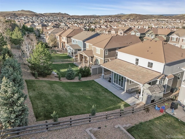 aerial view of residential area featuring a mountainous background
