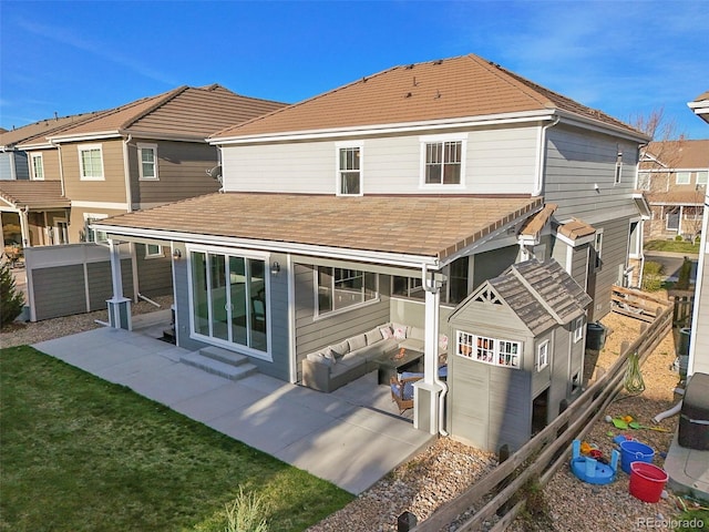 rear view of property with an outdoor hangout area, a patio, a shingled roof, and fence