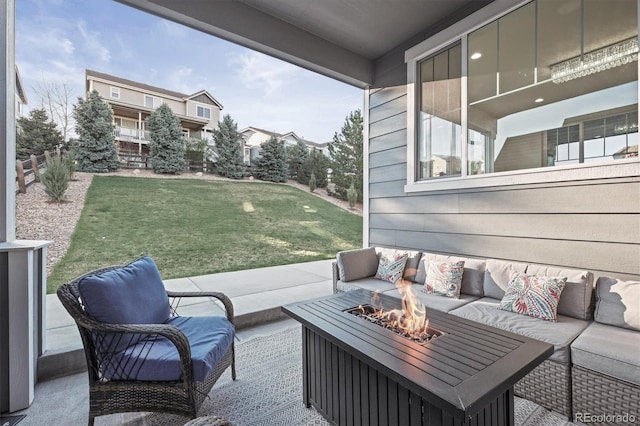 view of patio / terrace with an outdoor living space with a fire pit
