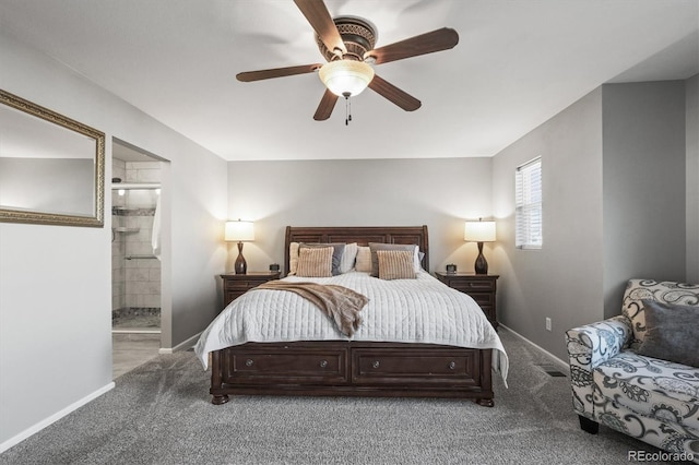 carpeted bedroom with baseboards, ensuite bath, and a ceiling fan