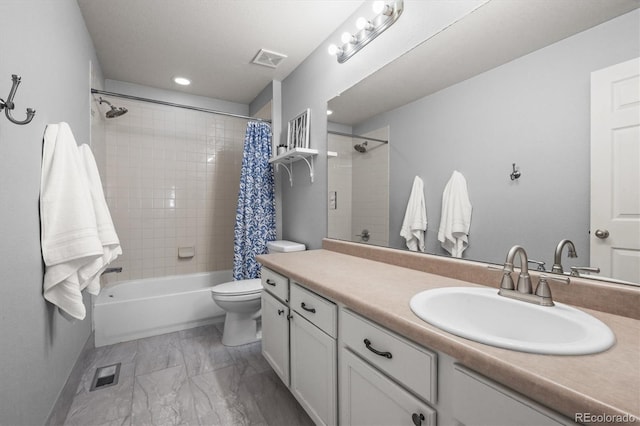 bathroom featuring marble finish flooring, vanity, toilet, shower / bath combo, and baseboards