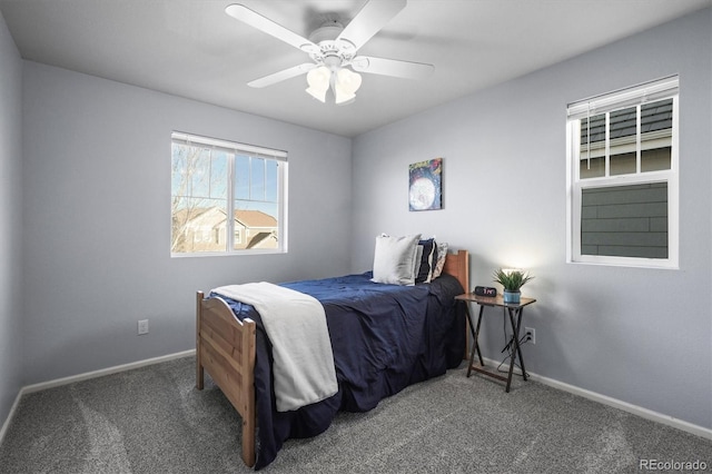 carpeted bedroom with baseboards and ceiling fan