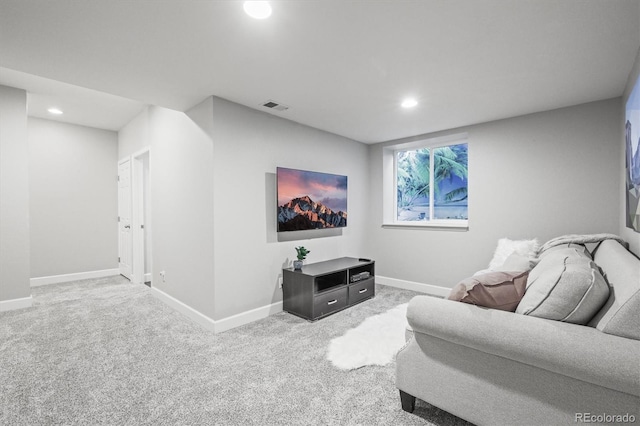 living area featuring recessed lighting, baseboards, and carpet floors
