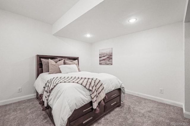 carpeted bedroom featuring baseboards and recessed lighting