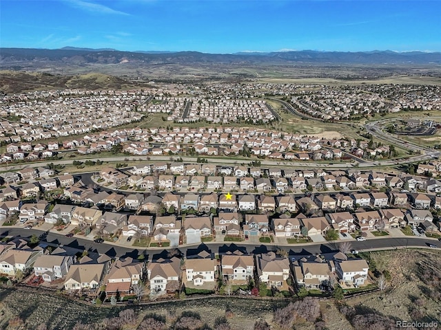 view of property location featuring nearby suburban area and a mountainous background