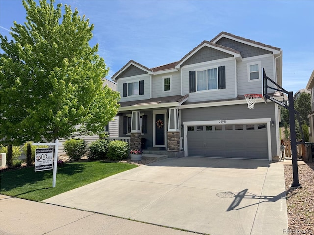 2198 Broadleaf Loop, Castle Rock, CO 80109 - craftsman house featuring an attached garage, concrete driveway, and a front lawn