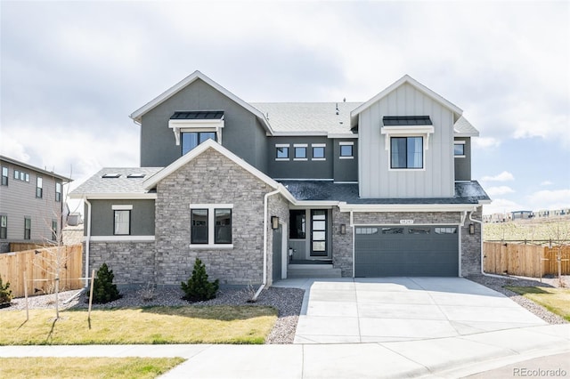 14247 Beebalm Loop, Parker, CO 80134 - view of front of home featuring board and batten siding, fence, concrete driveway, stone siding, and a garage