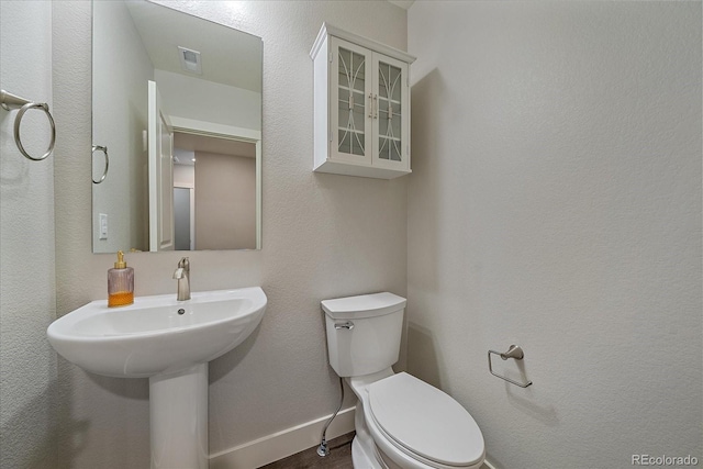 bathroom featuring toilet