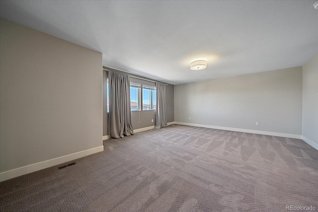 spare room with carpet flooring