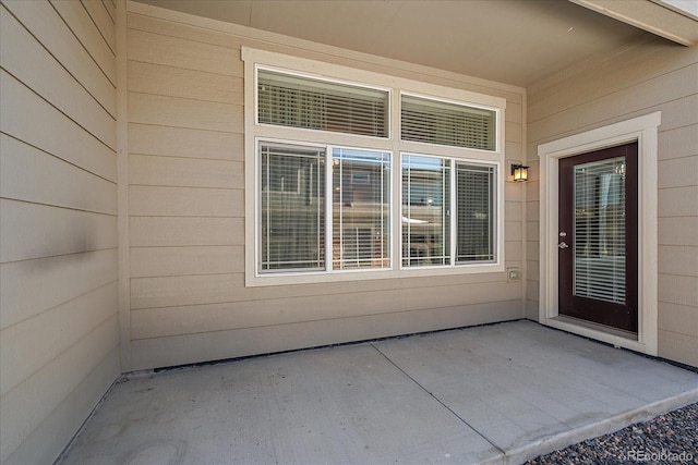 doorway to property featuring a patio