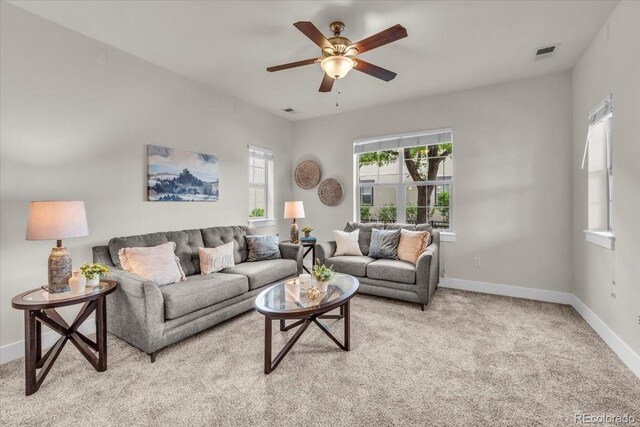 3372 Central Park Blvd, Denver, CO 80238 - living area featuring ceiling fan and light colored carpet