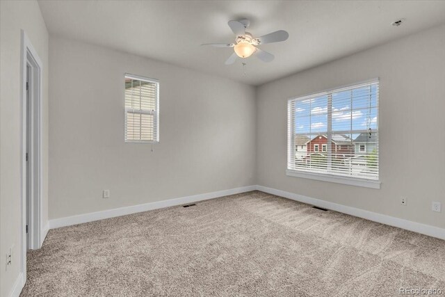 3372 Central Park Blvd, Denver, CO 80238 - spare room featuring carpet and ceiling fan