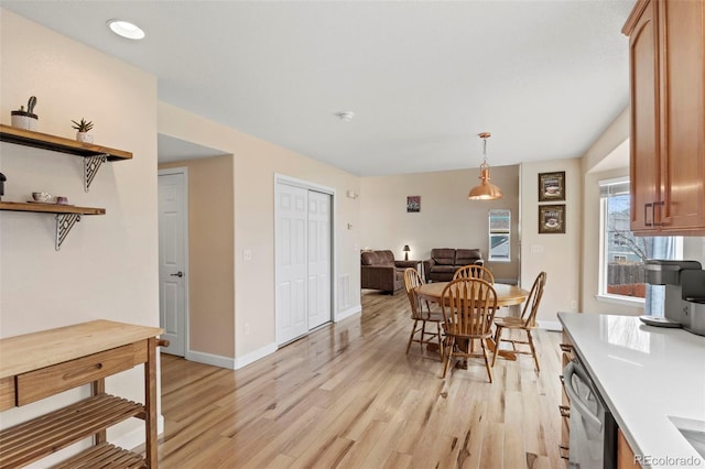 4426 Crow Creek Dr, Colorado Springs, CO 80922 - dining space featuring light wood-style floors and baseboards