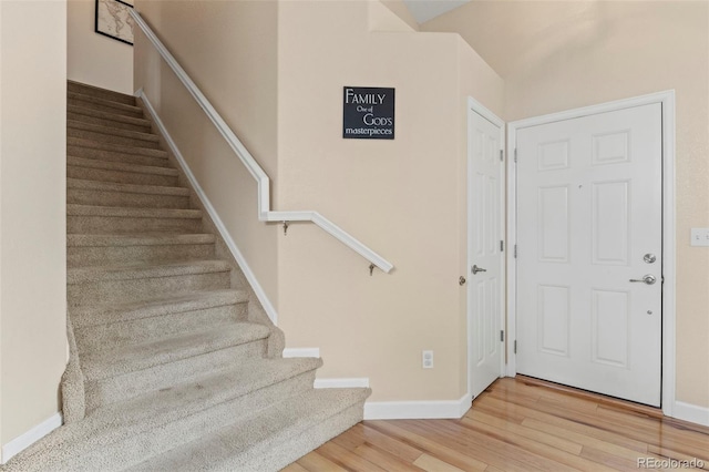 4426 Crow Creek Dr, Colorado Springs, CO 80922 - stairs with wood finished floors and baseboards