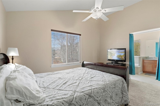 4426 Crow Creek Dr, Colorado Springs, CO 80922 - carpeted bedroom featuring lofted ceiling, connected bathroom, and a ceiling fan