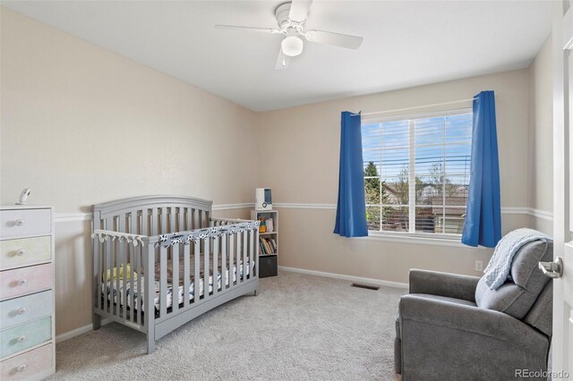 4426 Crow Creek Dr, Colorado Springs, CO 80922 - bedroom with carpet floors, a crib, and baseboards