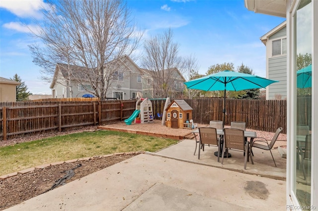 4426 Crow Creek Dr, Colorado Springs, CO 80922 - view of patio / terrace with a playground and outdoor dining space