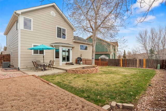 4426 Crow Creek Dr, Colorado Springs, CO 80922 - back of property with a patio area and central AC unit