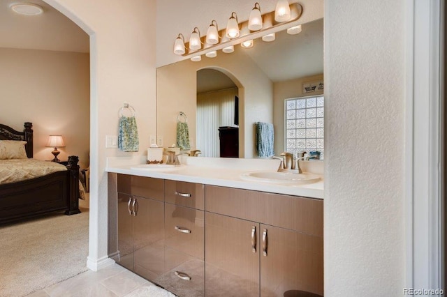 bathroom with tile patterned floors and vanity