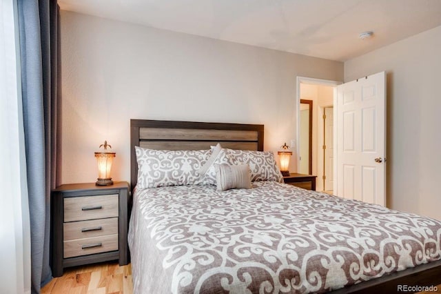 bedroom with wood-type flooring