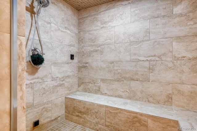 bathroom with a tile shower