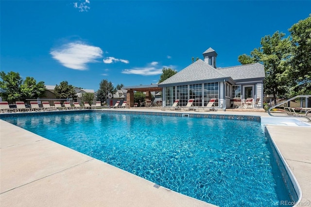 view of swimming pool featuring a patio area