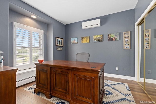 2370 W 152nd Ave, Broomfield, CO 80023 - home office featuring baseboard heating, a wall unit AC, and wood finished floors